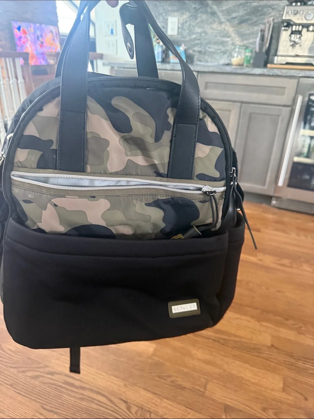 Skip Hop Black Diaper Backpack with Camo Front Pocket and Tassel